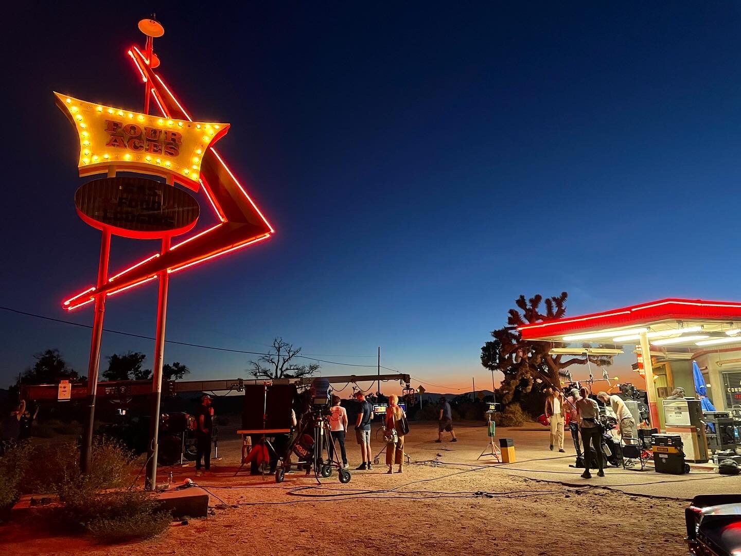 Night exterior shoot at a neon-lit roadside diner